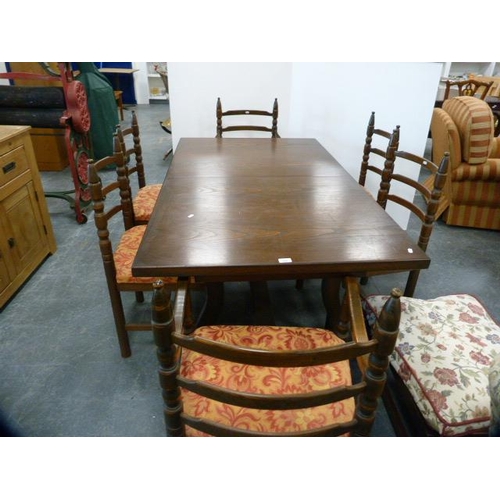 288 - Oak veneered dining table and a set of six ladder-back dining chairs, including two carvers, also a ... 