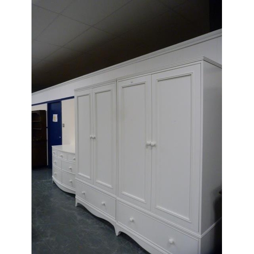 296 - Laura Ashley white painted three piece bedroom suite comprising a pair of two-door wardrobes, each w... 