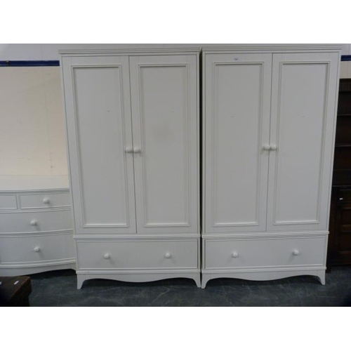 296 - Laura Ashley white painted three piece bedroom suite comprising a pair of two-door wardrobes, each w... 