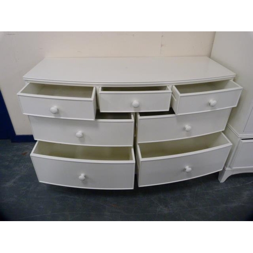 296 - Laura Ashley white painted three piece bedroom suite comprising a pair of two-door wardrobes, each w... 