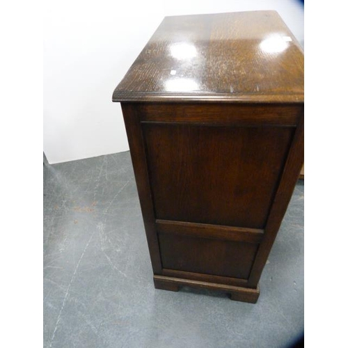 306 - Oak television cabinet with two doors above two drawers.