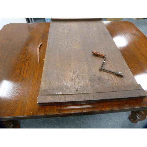 312 - Oak telescopic dining table, c. early 20th century, with one additional leaf, on barley column suppo... 