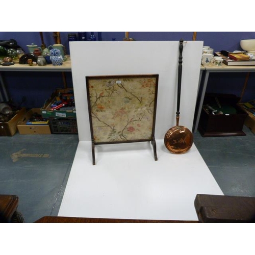 316 - Copper bed warming pan and an oak-framed fire screen bearing an Oriental silk embroidered panel to t... 