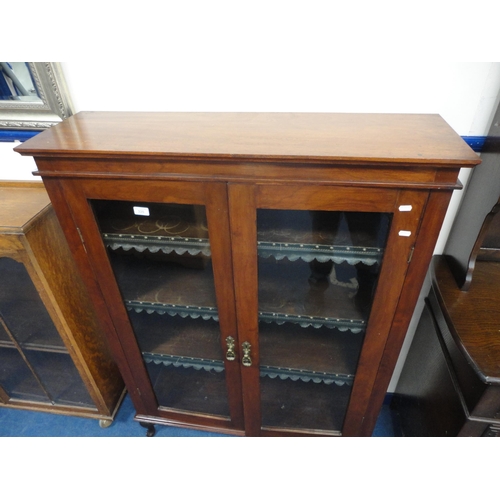 320 - Mahogany glazed two-door bookcase.