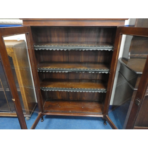 320 - Mahogany glazed two-door bookcase.