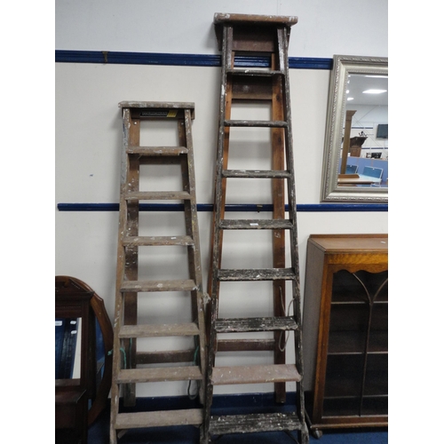 323 - Two sets of vintage wooden stepladders.