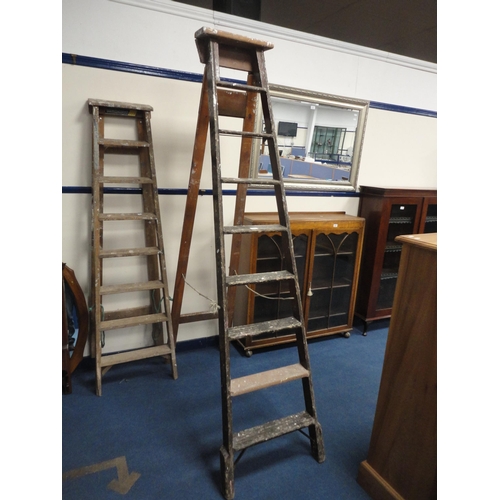 323 - Two sets of vintage wooden stepladders.