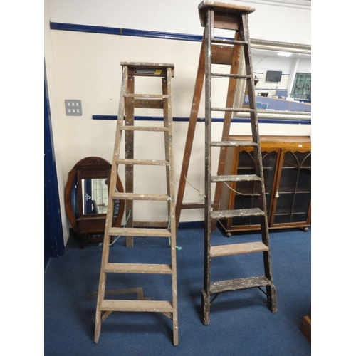 323 - Two sets of vintage wooden stepladders.