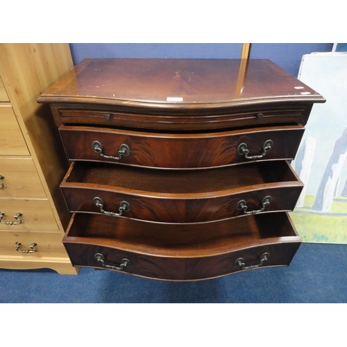 329 - Reproduction mahogany serpentine chest of drawers.