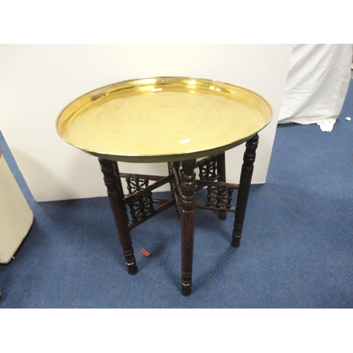 333 - Indian Benares brass tray table on folding supports.