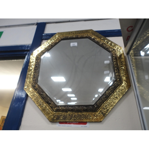 340 - Brass hammered octagonal wall mirror.