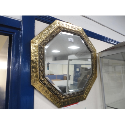 340 - Brass hammered octagonal wall mirror.