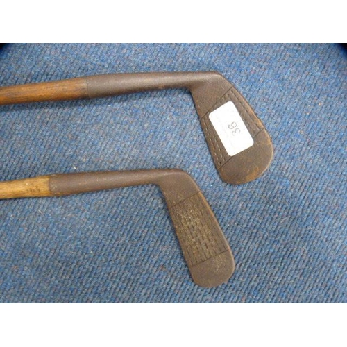 36 - Two hickory-shafted golf clubs, one marked 'Mashie, Made in Scotland, J McNair Special St Andrews'. ... 