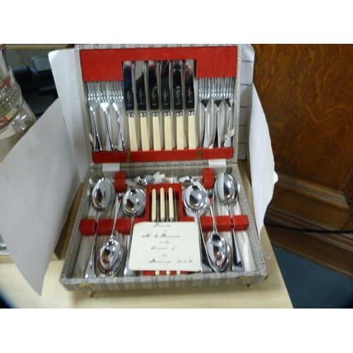 69 - Collection of boxed cutlery to include a set of six plated Apostle spoons, teaspoons and tongs, butt... 