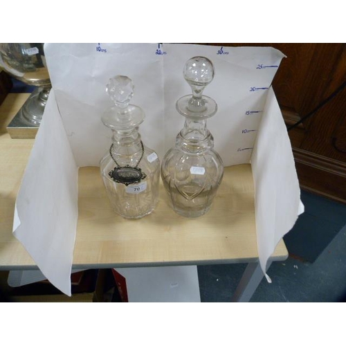 70 - Two Georgian-style glass decanters, one with a whisky label.