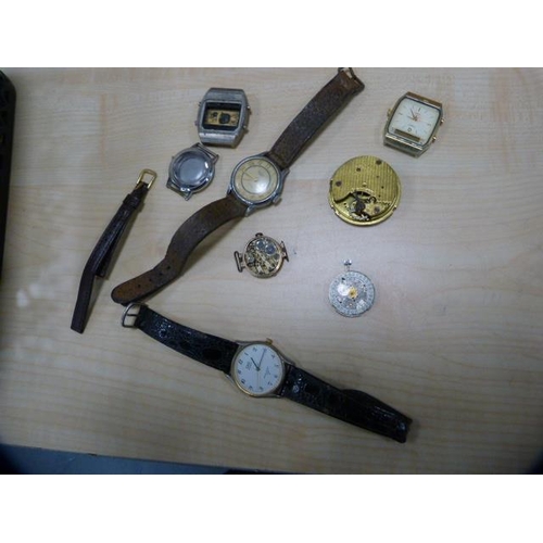 79 - Small box containing a quantity of pocket watch parts, dials, movements etc., also manual wind movem... 