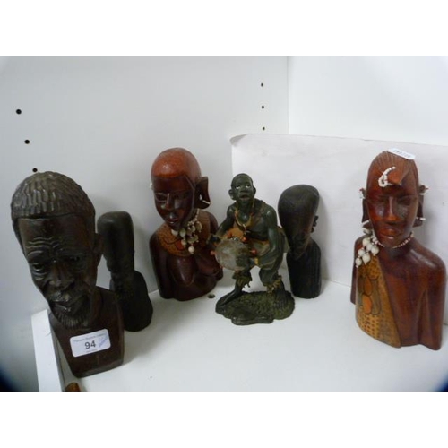 94 - African-style hardwood busts, walking stick, Capodimonte-style vase and an Indian-style candle sconc... 