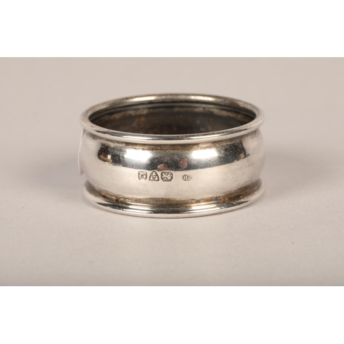 191 - Silver and mother of pearl childs rattle in the form of a dog, silver napkin ring (3)