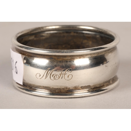 191 - Silver and mother of pearl childs rattle in the form of a dog, silver napkin ring (3)