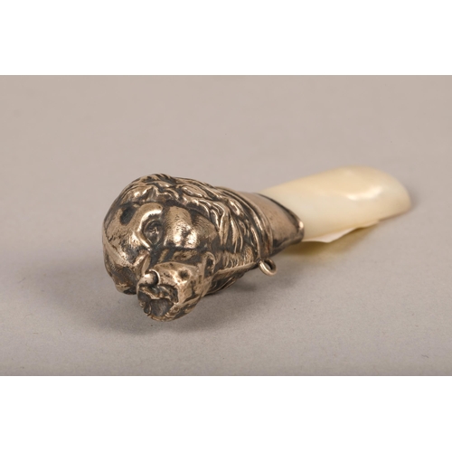 191 - Silver and mother of pearl childs rattle in the form of a dog, silver napkin ring (3)