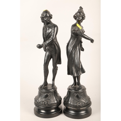 244 - Two cast metal figures of a gentleman and lady dancing