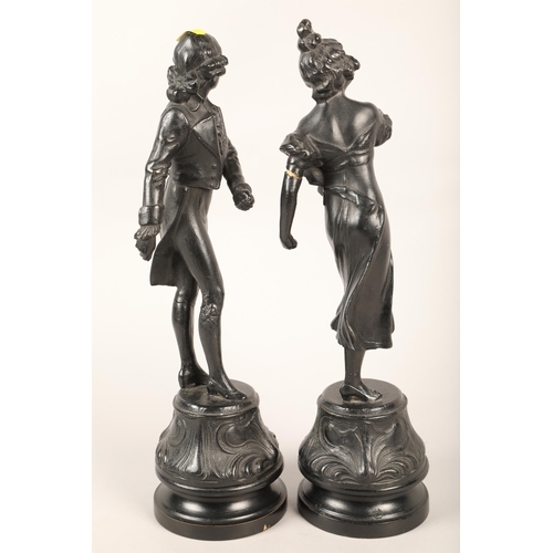 244 - Two cast metal figures of a gentleman and lady dancing