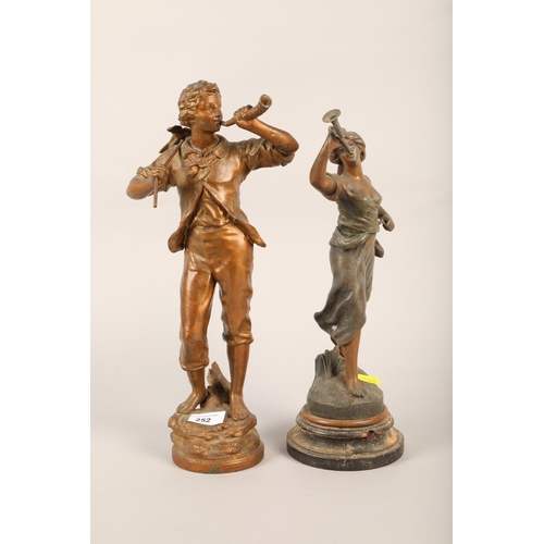 252 - Two cast metal figures of a gentleman and lady playing instruments