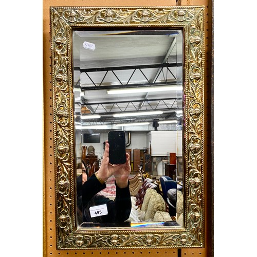 493 - Brass bound embossed thistle rectangular shaped mirror, 54cm x 34cm