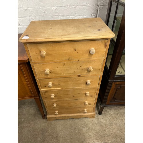 602 - Pine six drawer chest.106 cm high 60 cm wide