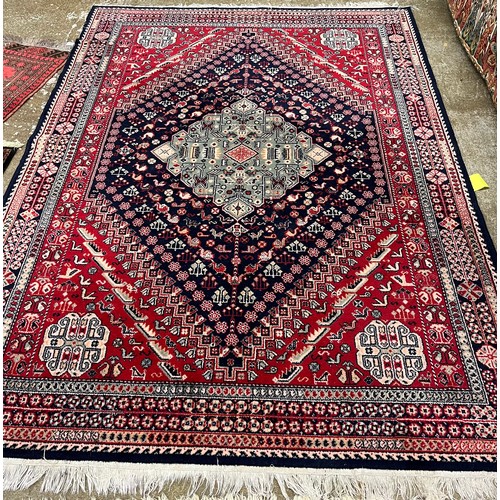 620 - Red patterned rug.240cm X 170 cm 