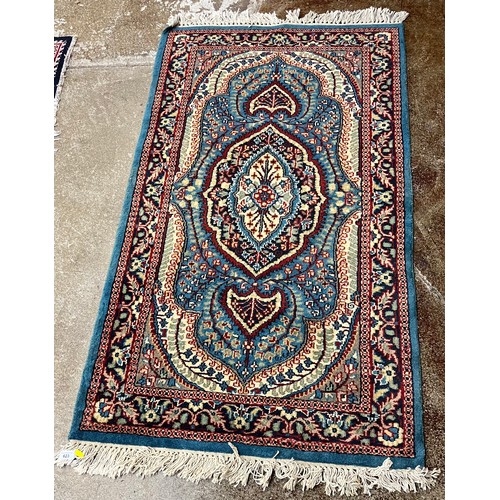 623 - Blue patterned rug.164 cm x 90 cm