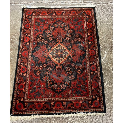 626 - Pair of red patterned samarkand rugs.94 cm X 67 cm 