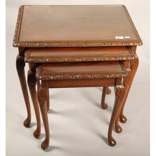 587 - Mahogany nest of three tables, glass topped