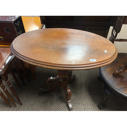 573 - Oval side table with ornate legs