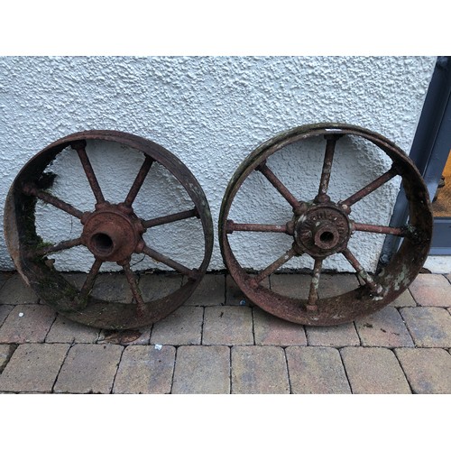 543 - Two cast iron wheels, 58cm x 58cm