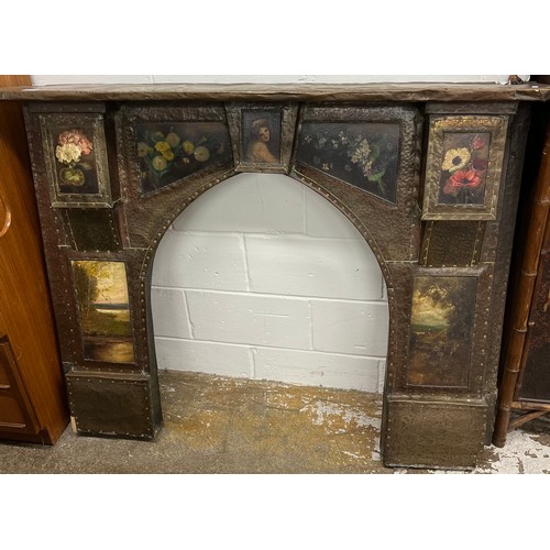 653 - Arts and crafts copper fire surround, with oil on boards depicting still lifes, pastoral scenes, in ... 