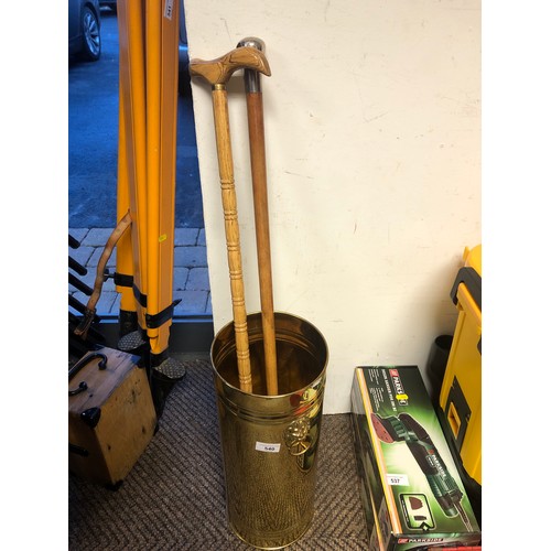 540 - Brass bin with two walking canes (including one with silver handle)