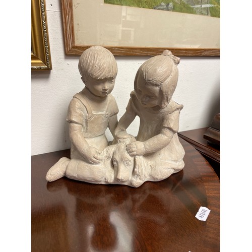 517 - Plaster bust of boy and girl clapping girl