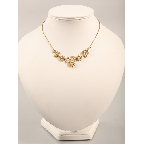 67 - 15 ct yellow gold floral necklace with seed pearlsweight 10 grams