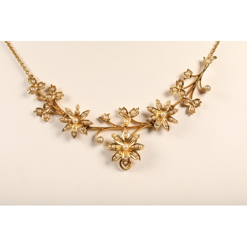 67 - 15 ct yellow gold floral necklace with seed pearlsweight 10 grams