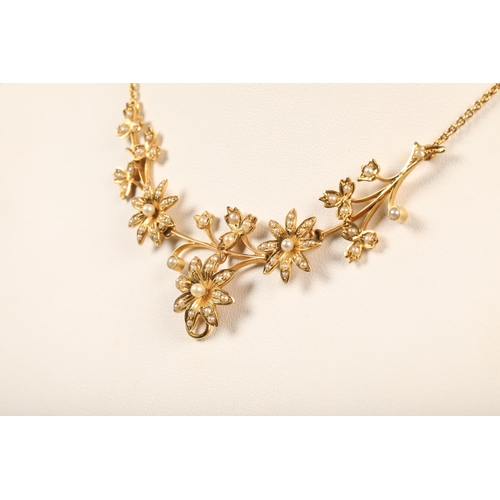 67 - 15 ct yellow gold floral necklace with seed pearlsweight 10 grams