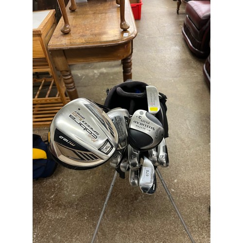 675 - Set of gold clubs including, Big Bertha, Odysse Dual force ,King Cobra golf in bag