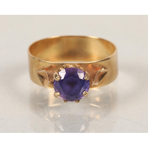 144 - 9ct gold dress ring with purple stone