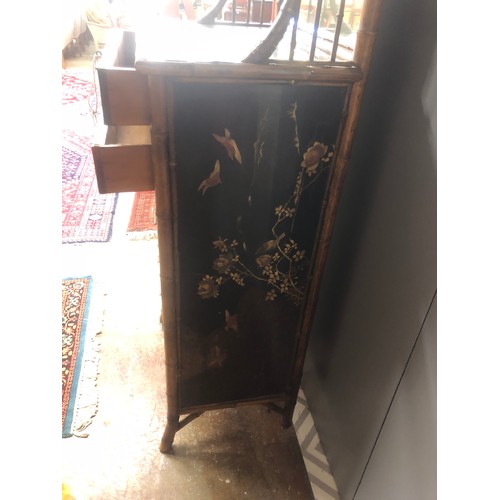 596 - Oriental lacquered bamboo side chest with mirror back.180 cm high 66 cm wide