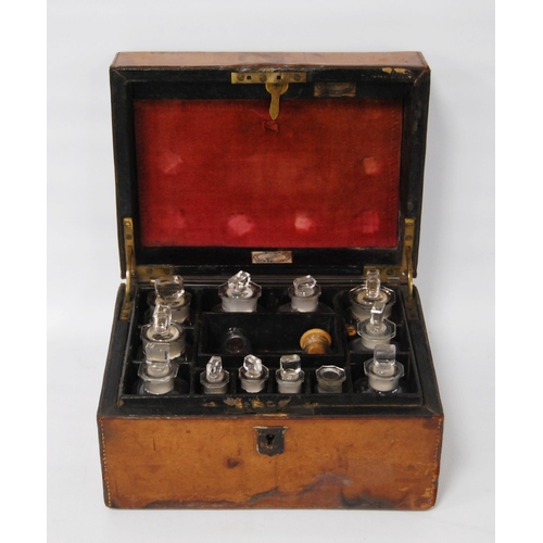 297 - Victorian tooled portable chemist's box containing glass bottles within a fitted interior, bearing a... 