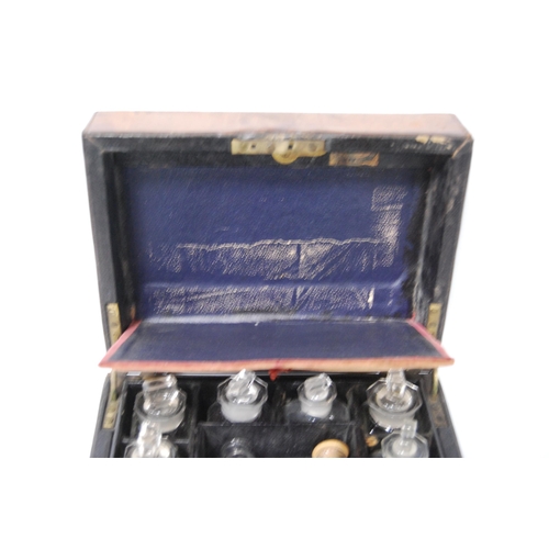 297 - Victorian tooled portable chemist's box containing glass bottles within a fitted interior, bearing a... 