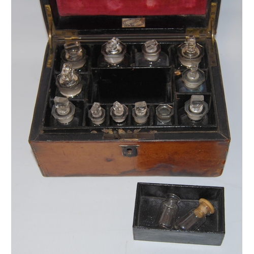 297 - Victorian tooled portable chemist's box containing glass bottles within a fitted interior, bearing a... 