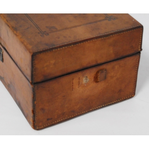 297 - Victorian tooled portable chemist's box containing glass bottles within a fitted interior, bearing a... 