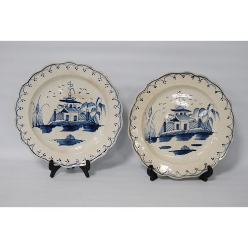 216 - Pair of late 18th century creamware blue and white plates, 24.5cm diameter.  (2)