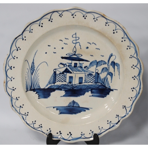 216 - Pair of late 18th century creamware blue and white plates, 24.5cm diameter.  (2)